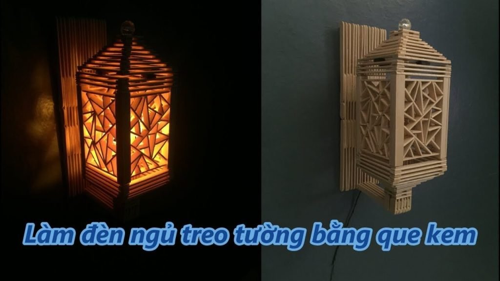 Đèn ngủ treo tường làm từ que kem, thiết kế handmade, ánh sáng ấm áp tạo không gian thư giãn cho căn phòng.